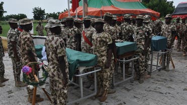 Nigerian soldiers stand on attention during the funeral on September 26, 2020 of the Nigerian soldiers killed in the attack near the shores of Lake Chad. (AFP)