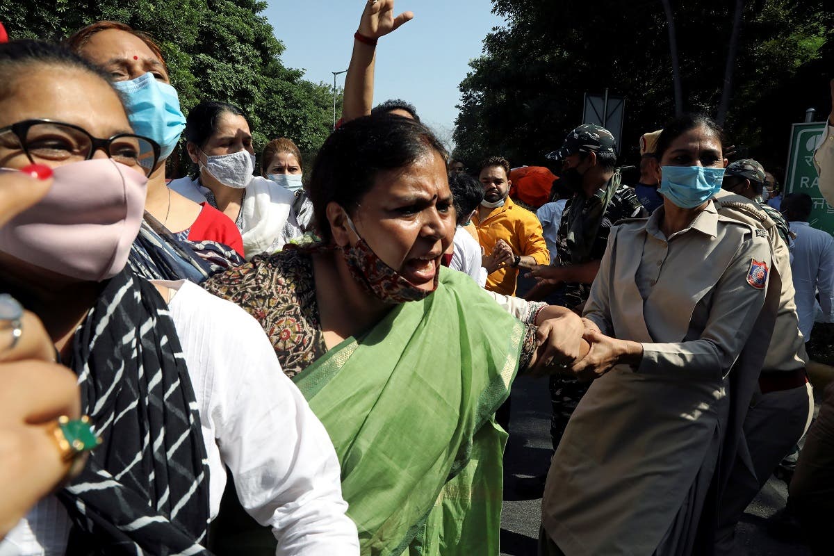 A supporter of India's main opposition Congress party is detained by police during a protest after the death of a rape victim, in front of Uttar Pradesh state bhawan (building) in New Delhi, India, on September 30, 2020. (Reuters)