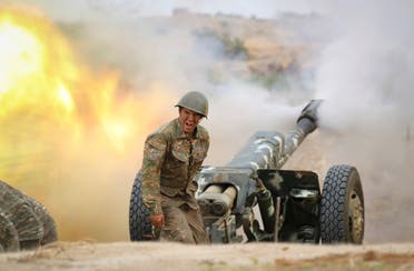 An Armenian serviceman fires a cannon towards Azerbaijan positions in the self-proclaimed Republic of Nagorno-Karabakh, Azerbaijan, Sept. 29, 2020. (AP)