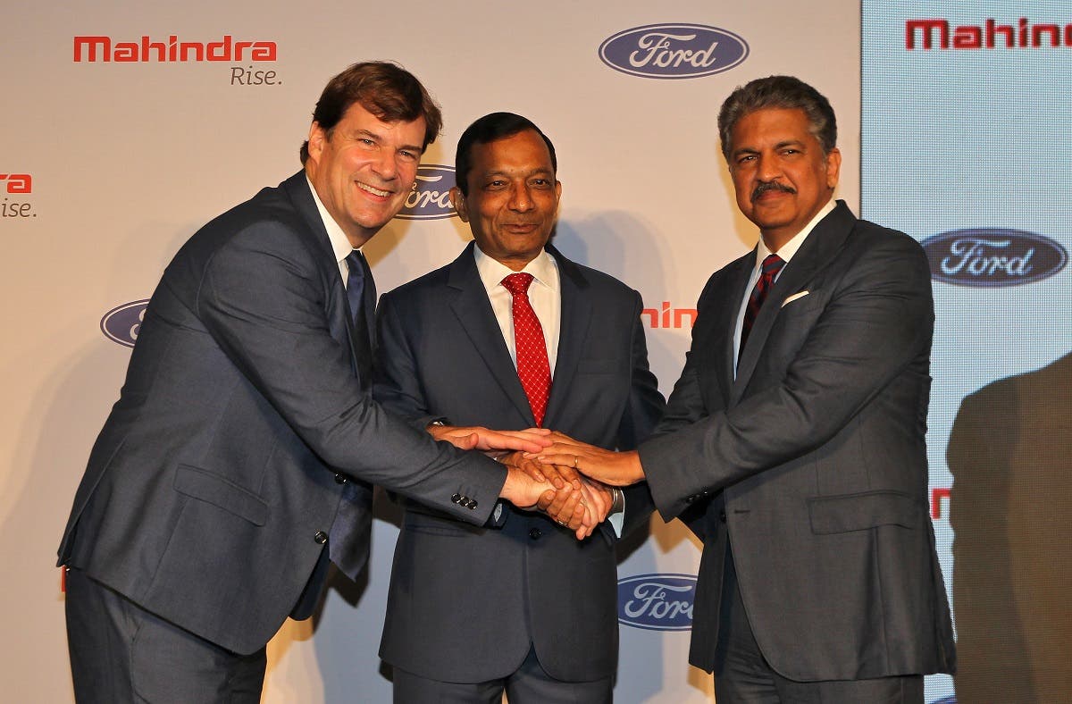 Jim Farley, President of Ford New Businesses, Technology & Strategy, Pawan Goenka, Managing Director of Mahindra & Mahindra Limited, and Anand Mahindra, Chairman of Mahindra Group, in Mumbai, India, on October 1, 2019. (Reuters)