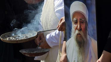 Iraqi Yazidis burn incense during the funeral of Baba Sheikh Khurto Hajji Ismail (image), supreme spiritual leader of the Yazidi religious minority, in the Iraqi town of Sheikhan, 50km northeast of Mosul, on October 2, 2020. (AFP)