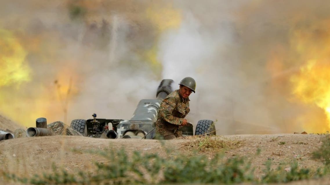 A serviceman of Karabakh's Defence Army fires an artillery piece towards Azeri positions during fighting over the breakaway Nagorny Karabakh region on September 28, 2020. (AFP)