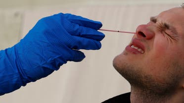 A medical member of the Austrian army performs a coronavirus disease (COVID-19) nasal swab test on a member of the military during the coronavirus outbreak in Vienna, Austria, May 4, 2020. (Reuters)