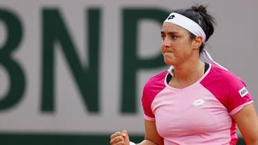 Tunisia’s Ons Jabour reacts after winning a point against Belarus’ Aryna Sabalenka during their women’s singles third round tennis match on Day 7 of The Roland Garros 2020 French Open tennis tournament in Paris on October 3, 2020. (AFP)