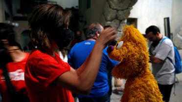 Staff of the children program Ahlan Simsim prepare puppets for filming a scene on the set of the show in a studio in Amman, Jordan. (Reuters)
