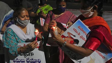 Activists of All India Democratic Women's Association lights candles during a protest condemning the alleged gang rape and killing of a Dalit woman, in Hyderabad, India on Oct. 3, 2020. (AP)