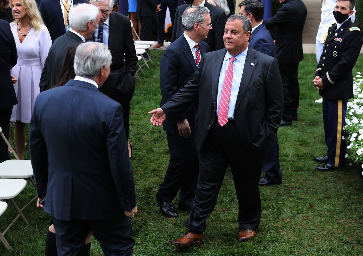 In this file photo taken on September 26, 2020, former New Jersey Governor Chris Christie (C) talks with guests in the Rose Garden after President Donald Trump nominated Judge Amy Coney Barrett to the Supreme Court at the White House in Washington, DC. (AFP)