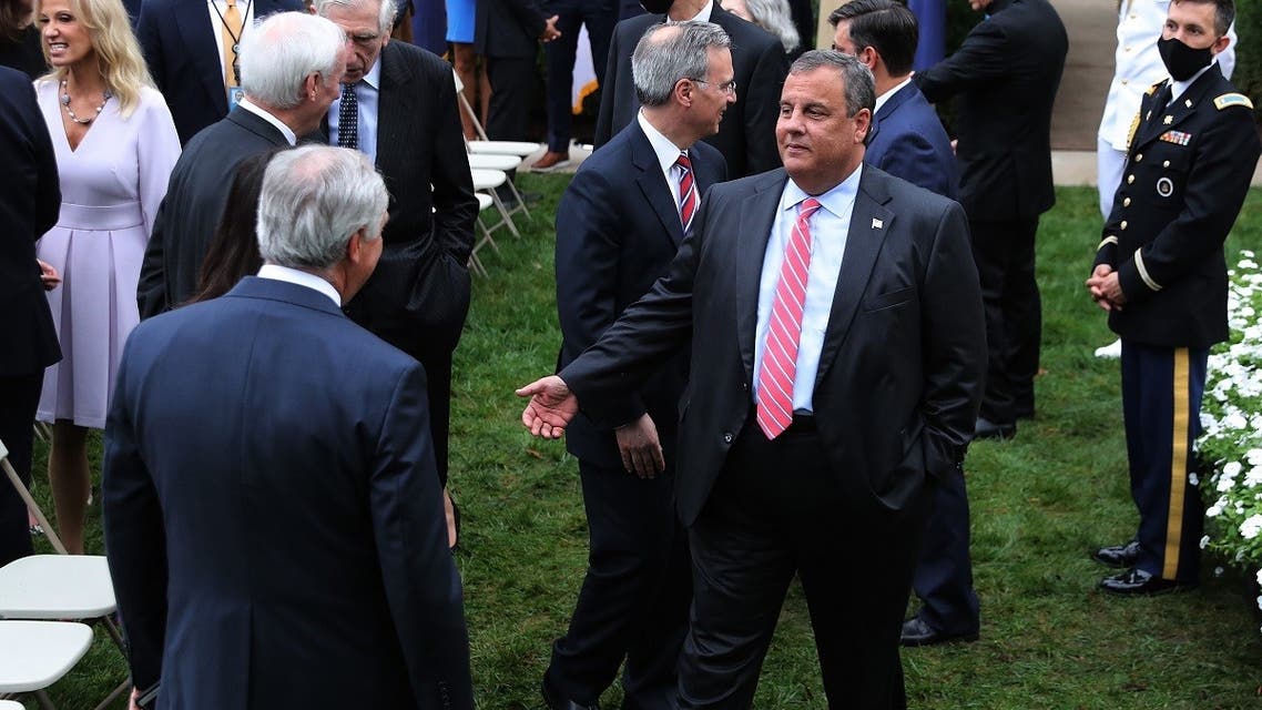 In this file photo taken on September 26, 2020, former New Jersey Governor Chris Christie (C) talks with guests in the Rose Garden after President Donald Trump nominated Judge Amy Coney Barrett to the Supreme Court at the White House in Washington, DC. (AFP)