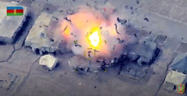 An image grab taken from a video made available on the official web site of the Azerbaijani Defence Ministry on October 2, 2020, allegedly shows Azeri units destroying an Armenian field control post. (AFP)
