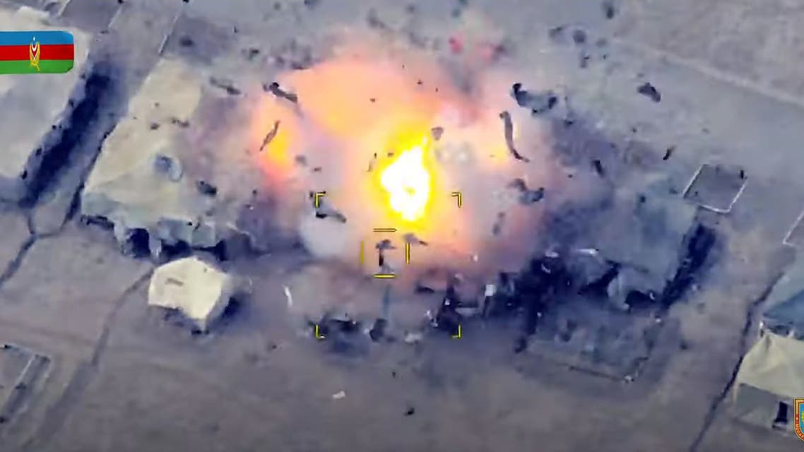 An image grab taken from a video made available on the official web site of the Azerbaijani Defence Ministry on October 2, 2020, allegedly shows Azeri units destroying an Armenian field control post during fighting over the breakaway Nagorno-Karabakh region. (AFP)