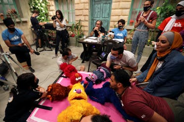 The staff of the children program Ahlan Simsim are seen as they film a scene on the set of the show in a studio in Amman, Jordan. (Reuters