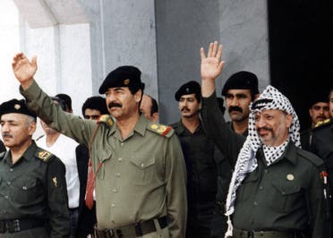 A photo from the files of the Palestinian Authority's press office (PPO) shows Palestinian leader Yasser Arafat (R) with Iraq's deposed president Saddam Hussein in Baghdad, 22 October, 1988. (AFP)