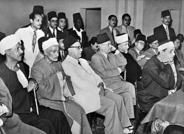 Former Grand Mufti of Palestine Mohammad Amin Al-Husseini (5-L, beard, white fez, dark robe) and leader of Egyptian National Party Hafiz Ramadan Pasha (4-L) attend a meeting of political parties delegates in Egypt in circa October 1951. (AFP)