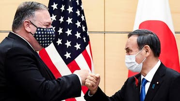 Japan’s Prime Minister Yoshihide Suga and US Secretary of State Mike Pompeo greet prior to their meeting at the prime minister's office in Tokyo, Japan, on October 6, 2020. (Reuters)
