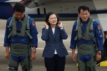 Taiwanese President Tsai Ing-Wen prepare to take photos with the pilots of AIDC T-5 Brave Eagle, Taiwan's first locally manufactured advanced jet trainer, in Taichung, Taiwan. (Reuters)