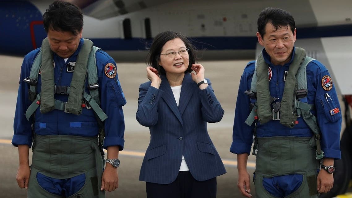 Taiwanese President Tsai Ing-Wen prepare to take photos with the pilots of AIDC T-5 Brave Eagle, Taiwan's first locally manufactured advanced jet trainer, in Taichung, Taiwan. (Reuters)