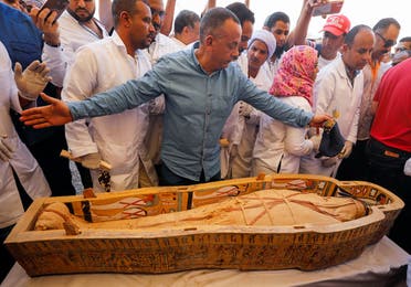 A mummy is seen inside a painted coffin discovered at Al-Asasif Necropolis in the Vally of Kings in Luxor. (Reuters)