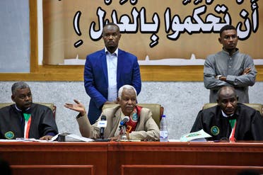 The presiding judge Issam al-Din Mohammad Ibrahim (C) speaks during a hearing in the trial of al-Bashir (unseen) and 27 co-accused over the 1989 military coup, in Khartoum, on October 6, 2020. (AFP)