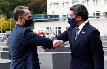 UAE Foreign Minister Sheikh Abdullah bin Zayed al-Nahyan greets German Foreign Minister Heiko Maas as he and his Israeli counterpart Gabi Ashkenazi visit the Holocaust memorial together prior to their historic meeting in Berlin, Germany October 6, 2020. (Reuters)