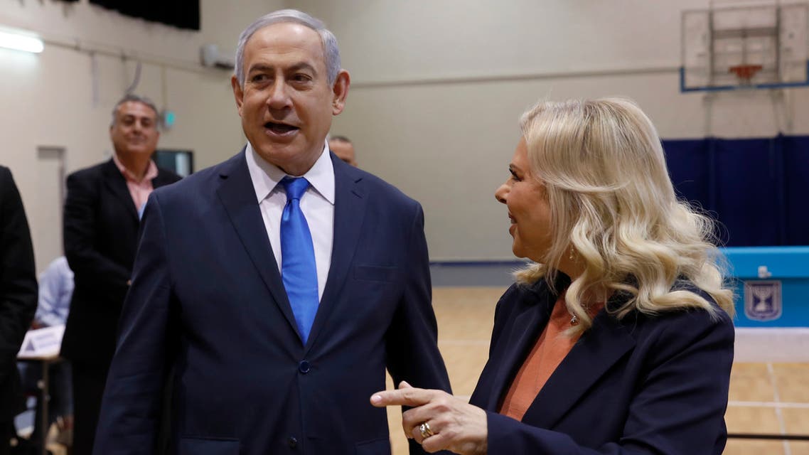 Israeli Prime Minister Benjamin Netanyahu and his wife Sara Netanyahu pause before casting their ballots during the Israeli legislative elections at a polling station in Jerusalem, Monday, March 2, 2020. (File photo: AP)