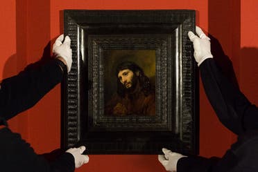 Staff at Louvre Abu Dhabi install the museum’s new acquisition, Rembrandt’s Head of a Young Man. (Courtesy: Louvre Abu Dhabi)
