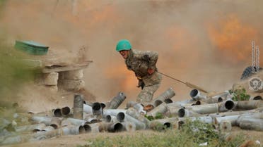 An ethnic Armenian soldier fires an artillery piece during fighting with Azerbaijan's forces in Nagorno-Karabakh. (File Photo: Reuters)