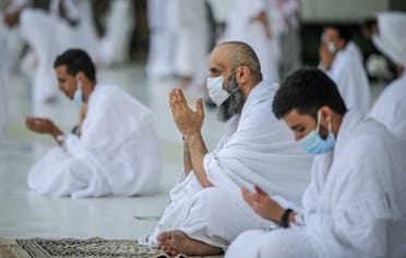 Muslims, keeping a safe social distance, perform Umrah at the Grand Mosque after Saudi authorities ease the coronavirus disease (COVID-19) restrictions, in the holy city of Mecca, Saudi Arabia. (Reuters)