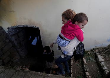 Local residents take shelter in the basement of a building during the fighting over the breakaway region of Nagorno-Karabakh, in Shushi. (Reuters)