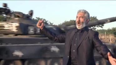 Lebanese-born Armenian opera singer Kevork Hadjian in front of a tank. (Facebook, Armenians in Lebanon)