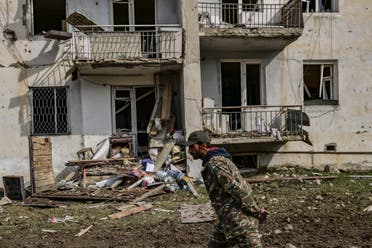A man walks in front of a destroyed house after shelling in the breakaway Nagorno-Karabakh region's main city of Stepanakert. (File photo: AFP)