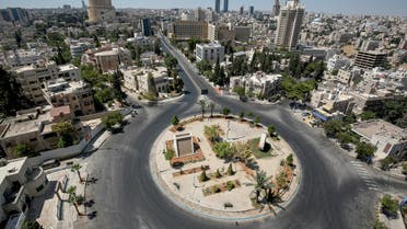 a view of an empty roundabout during a COVID-19 coronavirus pandemic curfew in the centre of Jordan's capital Amman. (AFP)