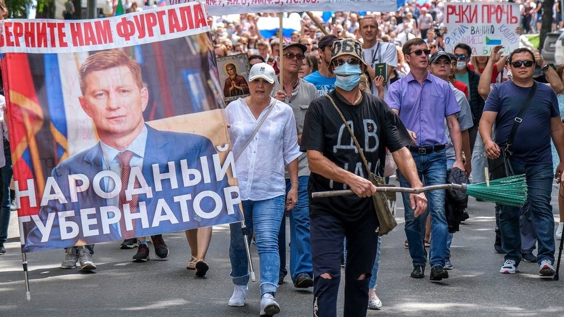 People carry a banner reading “Return Furgal for us”, during an unauthorised rally in support of Sergei Furgal in the Russian far eastern city of Khabarovsk on August 8, 2020. (AFP)