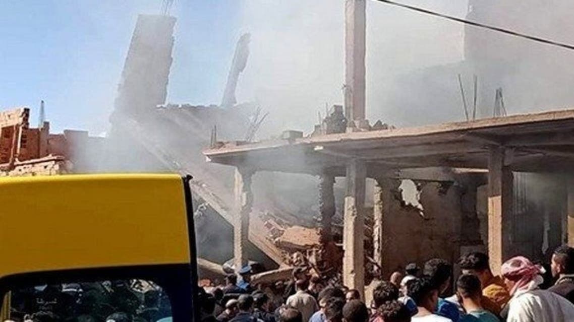 A photo posted by Algérie Presse Service on its Twitter account shows people gathered near buildings damaged by the gas blast in El Baydah on October 10, 2020. (Twitter/@APS_DZ)
