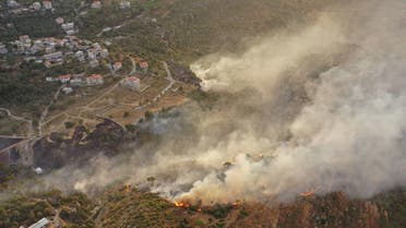An aerial view shows smoke rising from a fire amid a heatwave in the Metn district of Mount Lebanon on October 9, 2020. AFP