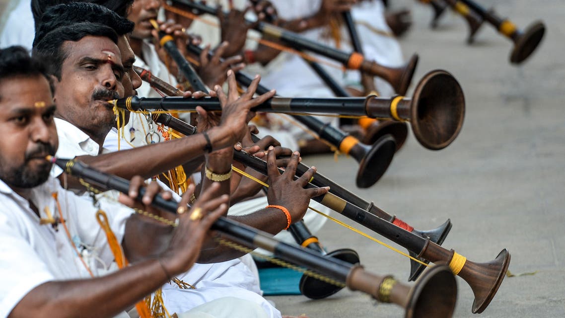 Musicians play the wind instruments called nadaswaram during a worship event to save people from the Covid-19 coronavirus in Chennai on October 9, 2020. (AFP)