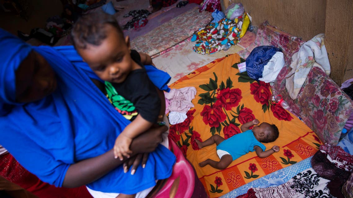 A child sleeps in a detention center, in west Tripoli, Libya, Wednesday, Sept. 5, 2018. (AP)