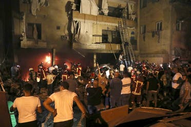Firefighters extinguish a fire at a building, after a diesel tank exploded in the neighborhood of Tariq al-Jadideh, in Beirut, Oct. 9, 2020. (AP)