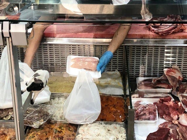 A butcher prepares chicken breasts for sale in Beirut, Lebanon. (Supplied)