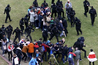 Law enforcement officers scuffle with demonstrators during a rally to protest against the Belarus presidential election results in Minsk on October 11, 2020. (AFP)