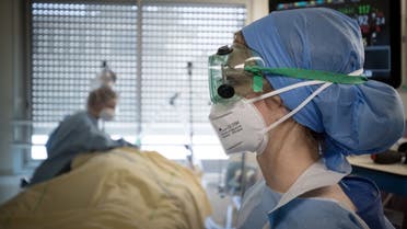 Medical workers tend to a patient infected with COVID-19 at the intensive care unit of the Lariboisiere Hospital of the AP-HP in Paris, France, April 27, 2020. (File photo: AFP)