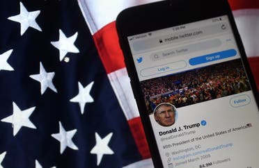 In this photo illustration, the Twitter account of US President Donald Trump is displayed on a mobile phone on August 10, 2020, in Arlington, Virginia. (AFP)