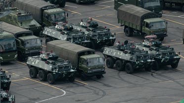 China beefed up its military presence by moving trucks and armored personnel carriers to the Shenzhen Bay stadium in Shenzhen, bordering Hong Kong, on August 16, 2019. (AFP)