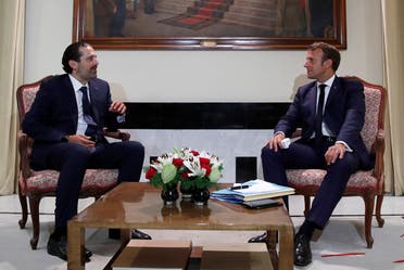 French President Emmanuel Macron meets former Lebanese Prime Minister Saad Hariri (L) at the Pine Residence, the official residence of the French ambassador to Lebanon, in Beirut, on August 31, 2020. (AFP)