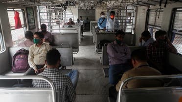 Commuters wait on a stalled suburban train during a power outage in Mumbai. (Reuters)