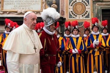 The Vatican Media shows Pope Francis (L) presides over a ceremony in The Vatican’s Clementine Hall, for the new Recruits of the Pontifical Swiss Guard. (AFP)