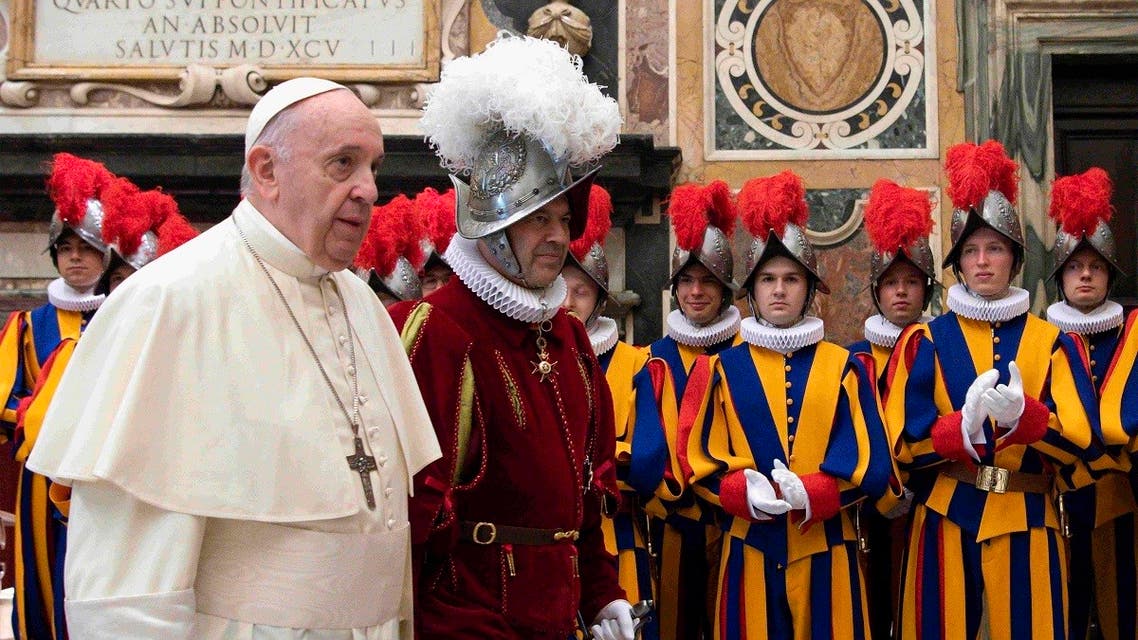 The Vatican Media shows Pope Francis (L) presides over a ceremony in The Vatican’s Clementine Hall, for the new Recruits of the Pontifical Swiss Guard. (AFP/Vatican Media)