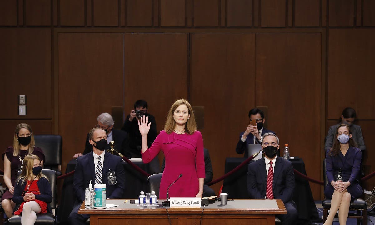 Supreme Court nominee Judge Amy Coney Barrett stands as she is sworn in during her confirmation hearing before the Senate Judiciary Committee, Oct. 12, 2020. (AFP)