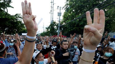 Pro-democracy protesters flash the three-fingers salute while attending a mass rally to call for the ouster of Prime Minister Prayuth Chan-ocha and reforms in the monarchy in front of parliament in Bangkok, Thailand. (Reuters)