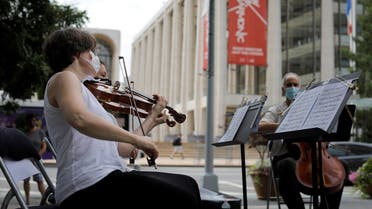 A string quartet made up of musicians from the New York Philharmonic Orchestra play first public performance since March in New York. (Reuters)