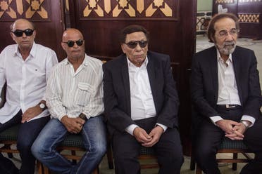 Egyptian actors Mahmoud Yassin, right, and Adel Imam, second right, attend the funeral of well-known Egyptian actor Nour el-Sherif at the Police Mosque in Cairo, Egypt, August 12, 2015. (AP/Ibrahim Ezzat)